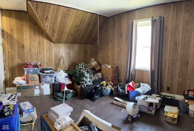 interior space featuring wood walls, wood-type flooring, and lofted ceiling