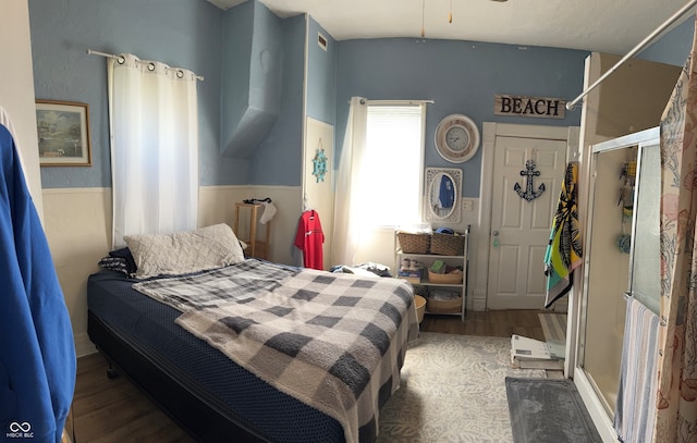 bedroom with a closet and dark hardwood / wood-style flooring