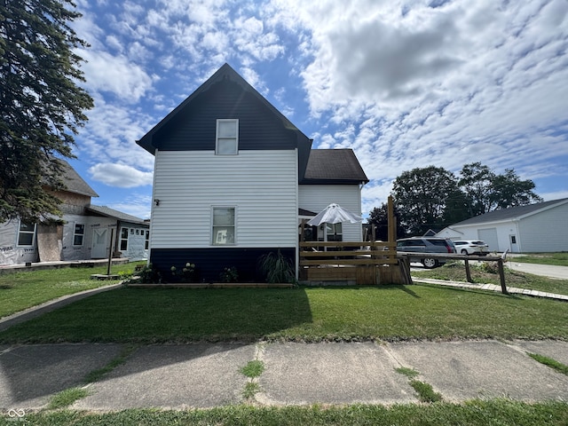 view of side of home featuring a yard