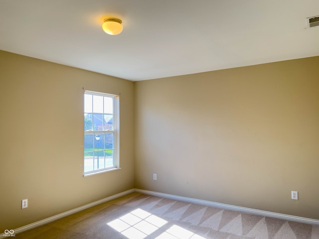 view of carpeted spare room