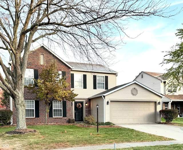 view of front of house with a front yard and a garage