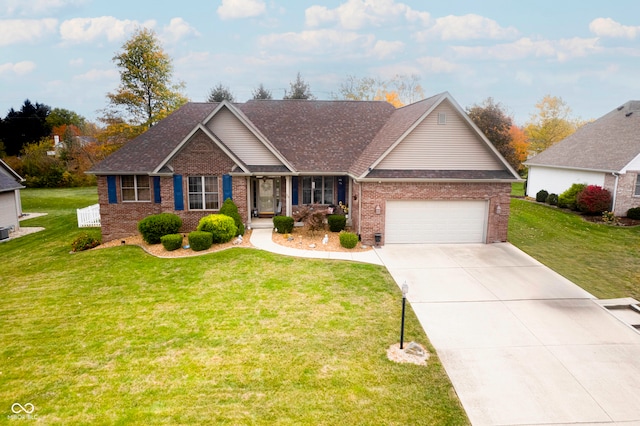 view of front of property with a front yard and a garage