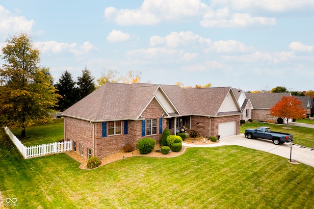 view of front of property with a front lawn and a garage