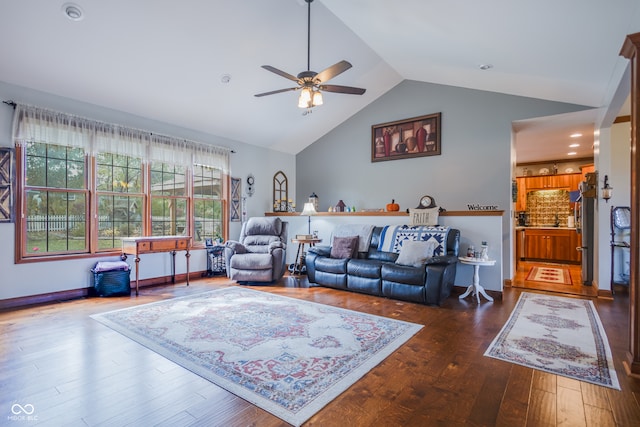 living room featuring lofted ceiling, ceiling fan, sink, and dark hardwood / wood-style flooring