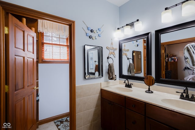 bathroom with vanity and tile patterned flooring