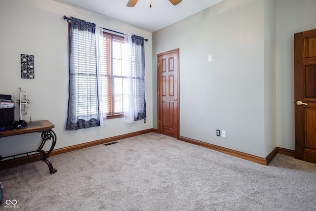 sitting room with light colored carpet and ceiling fan