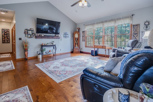 living room featuring hardwood / wood-style floors, vaulted ceiling, and ceiling fan