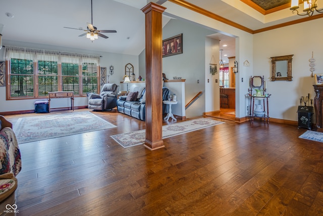 bedroom featuring ensuite bath, decorative columns, dark wood-type flooring, crown molding, and high vaulted ceiling