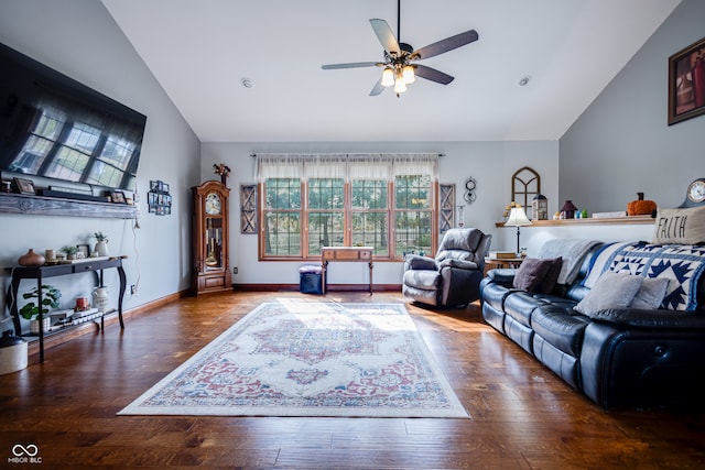 living room with ceiling fan, hardwood / wood-style flooring, and vaulted ceiling