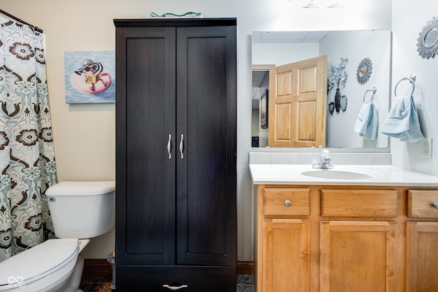 bathroom with toilet and vanity