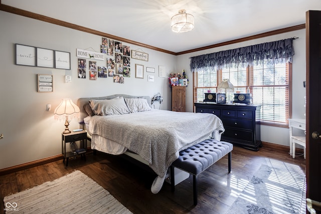 bedroom with crown molding and dark hardwood / wood-style floors