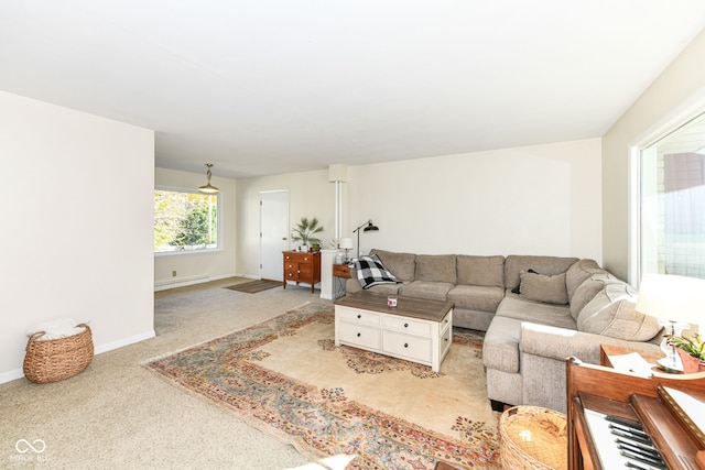 living room with light carpet and a baseboard radiator