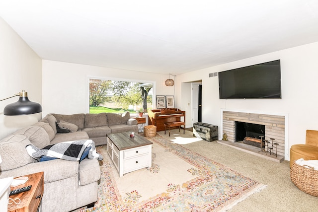 living room with light colored carpet and a brick fireplace