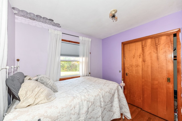 bedroom with a closet and light wood-type flooring