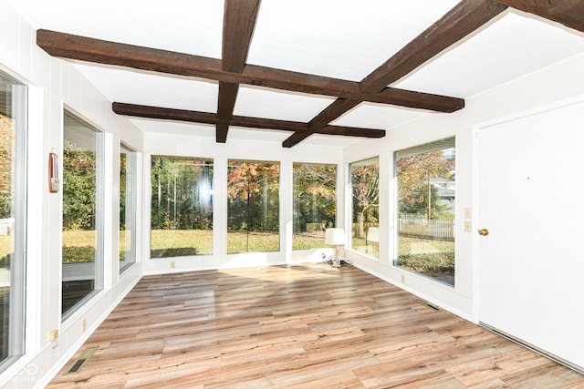 unfurnished sunroom with beamed ceiling and coffered ceiling