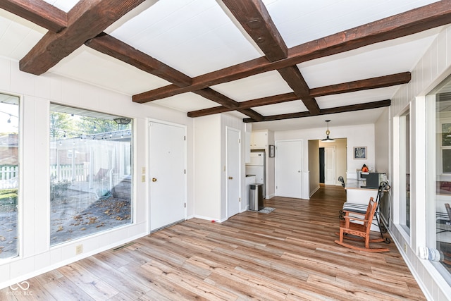 sunroom / solarium featuring beamed ceiling and coffered ceiling