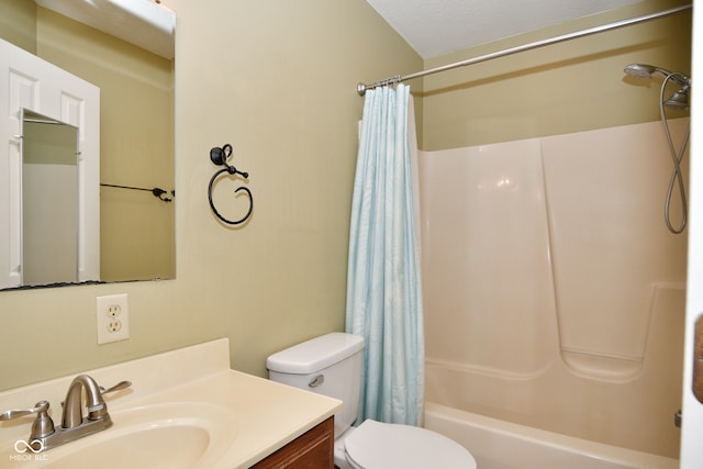 full bathroom featuring vanity, a textured ceiling, toilet, and shower / tub combo