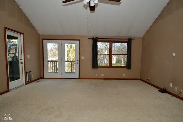 carpeted empty room with ceiling fan and vaulted ceiling