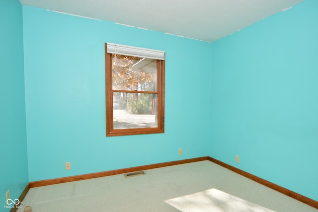 empty room with carpet flooring