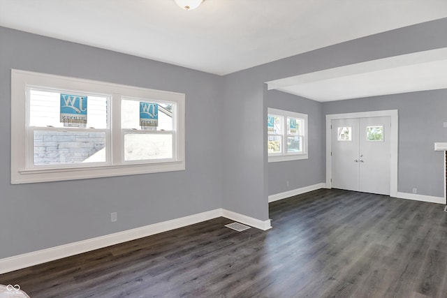 foyer entrance featuring dark hardwood / wood-style flooring