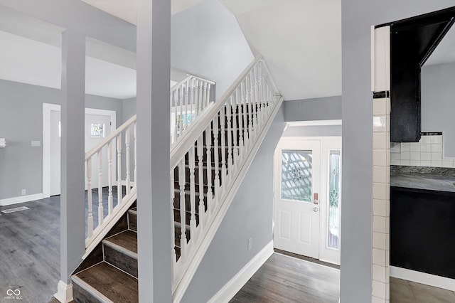 stairs with wood-type flooring