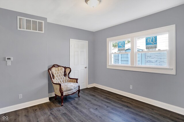 sitting room with dark hardwood / wood-style floors