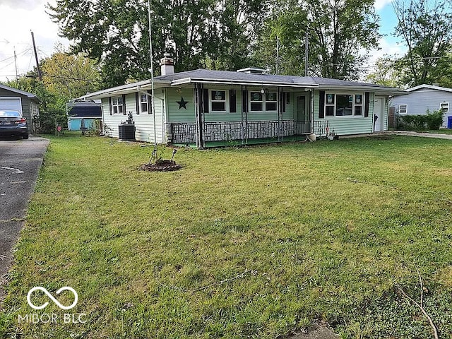 single story home featuring covered porch and a front lawn