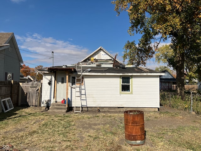 back of house with a yard