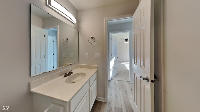 bathroom featuring vanity, ceiling fan, and hardwood / wood-style flooring