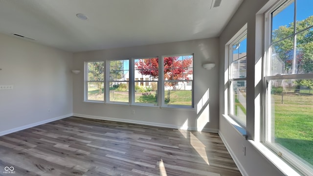 empty room with wood-type flooring