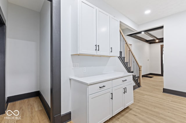 kitchen featuring light hardwood / wood-style flooring and white cabinets