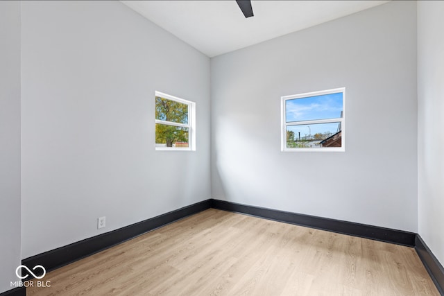 spare room featuring a healthy amount of sunlight and light wood-type flooring