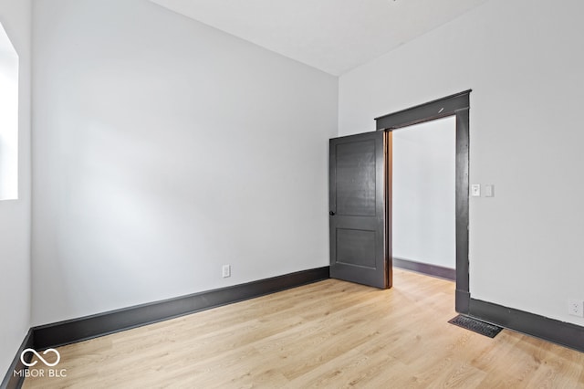 spare room with light hardwood / wood-style floors