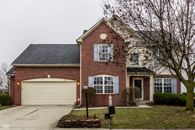 front facade featuring a front yard and a garage