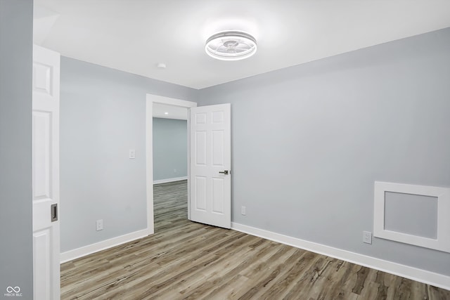 spare room featuring light hardwood / wood-style floors