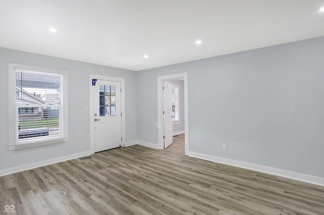 entrance foyer with light hardwood / wood-style flooring