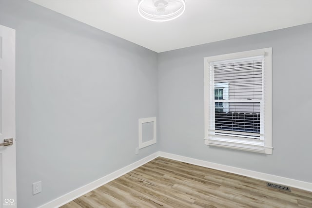 unfurnished room featuring light hardwood / wood-style flooring