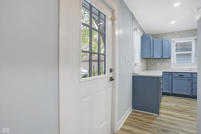 entryway with light hardwood / wood-style flooring