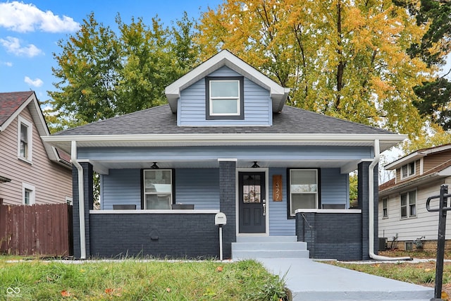 bungalow with a porch and central AC