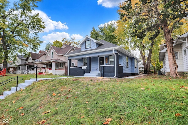 view of front of house with a front lawn and a porch