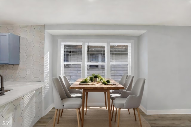 dining space with light hardwood / wood-style flooring