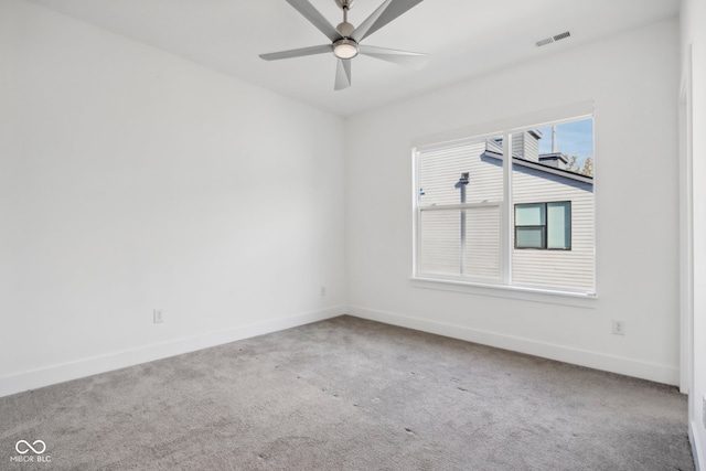 empty room with carpet flooring and ceiling fan