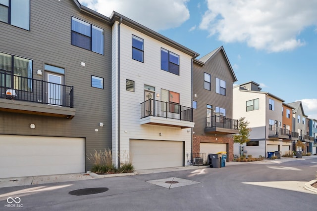 exterior space with a garage and central AC unit