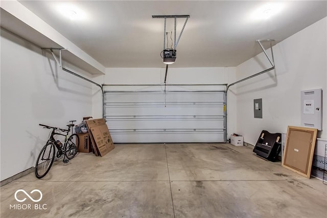 garage featuring a garage door opener and electric panel