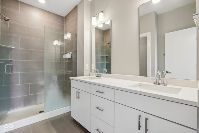 bathroom with vanity, tile patterned flooring, and an enclosed shower