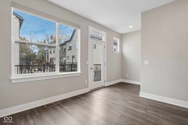 foyer with dark hardwood / wood-style floors