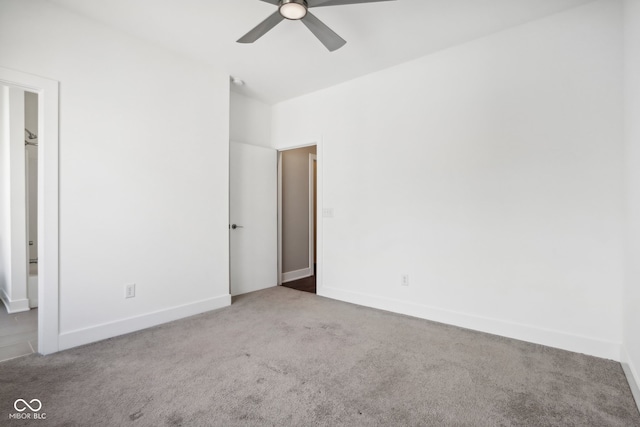 carpeted empty room featuring ceiling fan