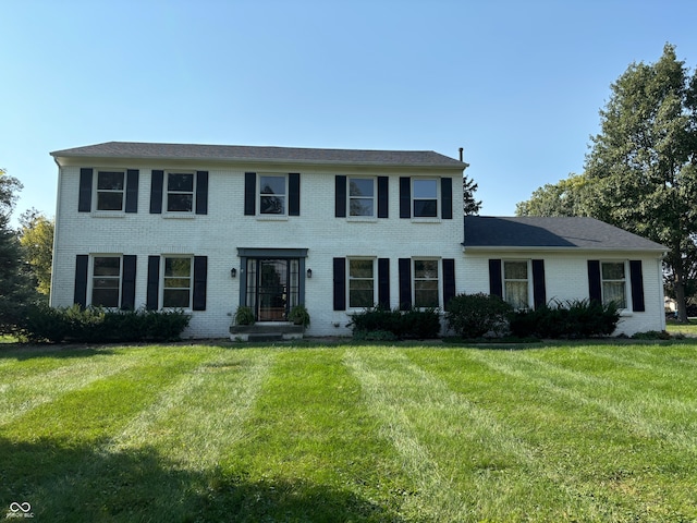 colonial home with a front yard