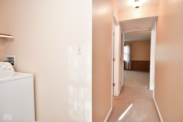 laundry room with washer / dryer and light carpet