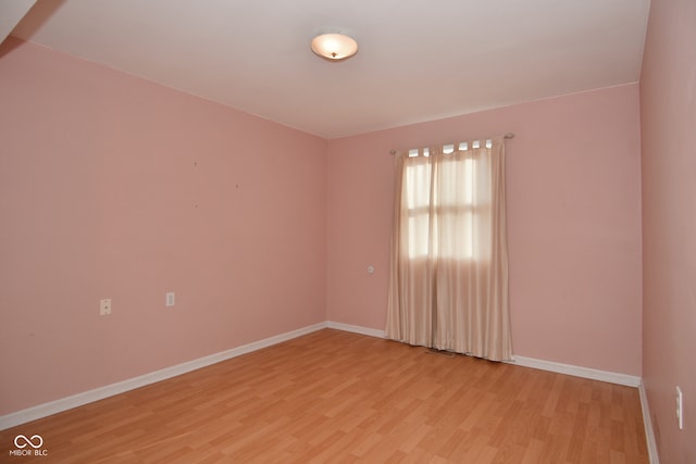 unfurnished room featuring light hardwood / wood-style floors